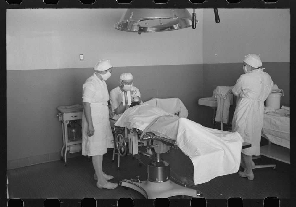 Giving the anesthetic for operation at the Cairns General Hospital at the FSA (Farm Security Administration) farmworkers…