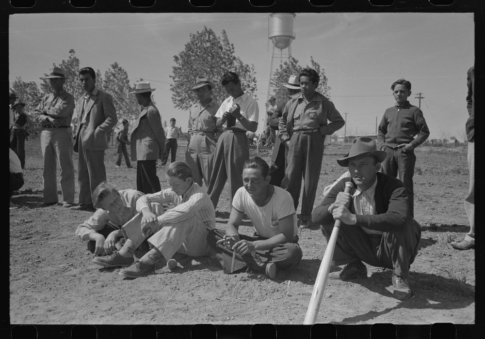 Watching baseball game at the annual field day at the FSA (Farm Security Administration) farmworkers community, Yuma…