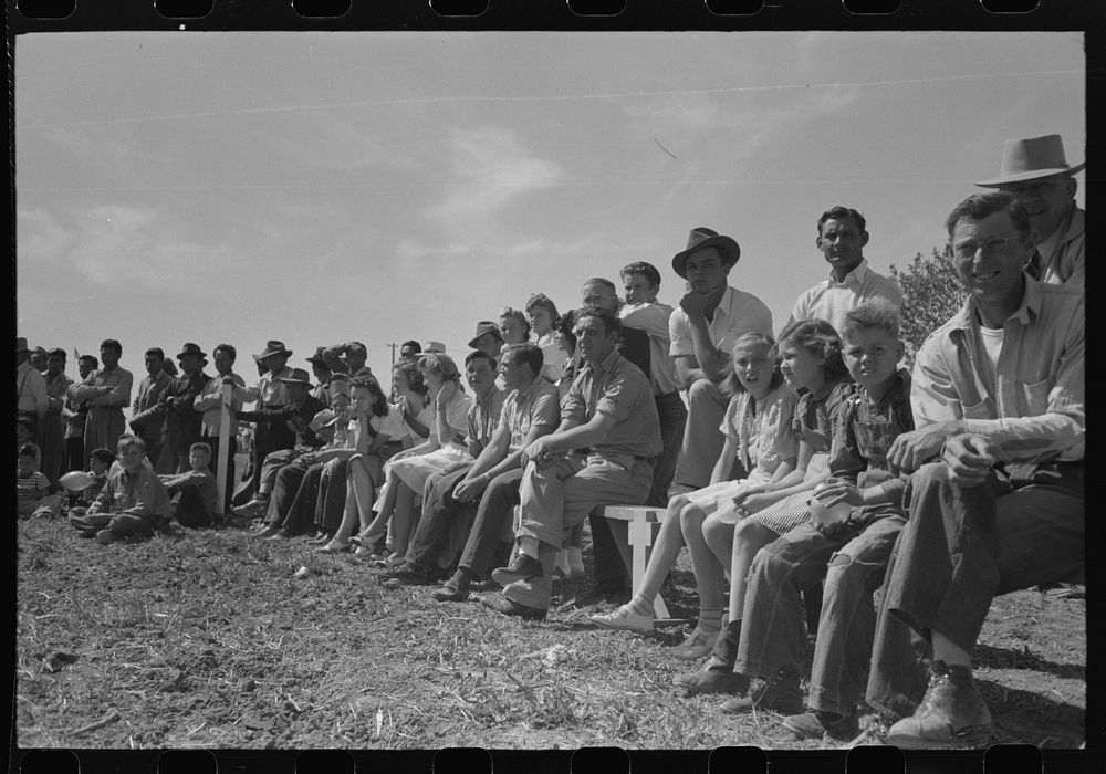 Watching basketball game at the annual field day at the FSA (Farm Security Administration) farmworkers community, Yuma…