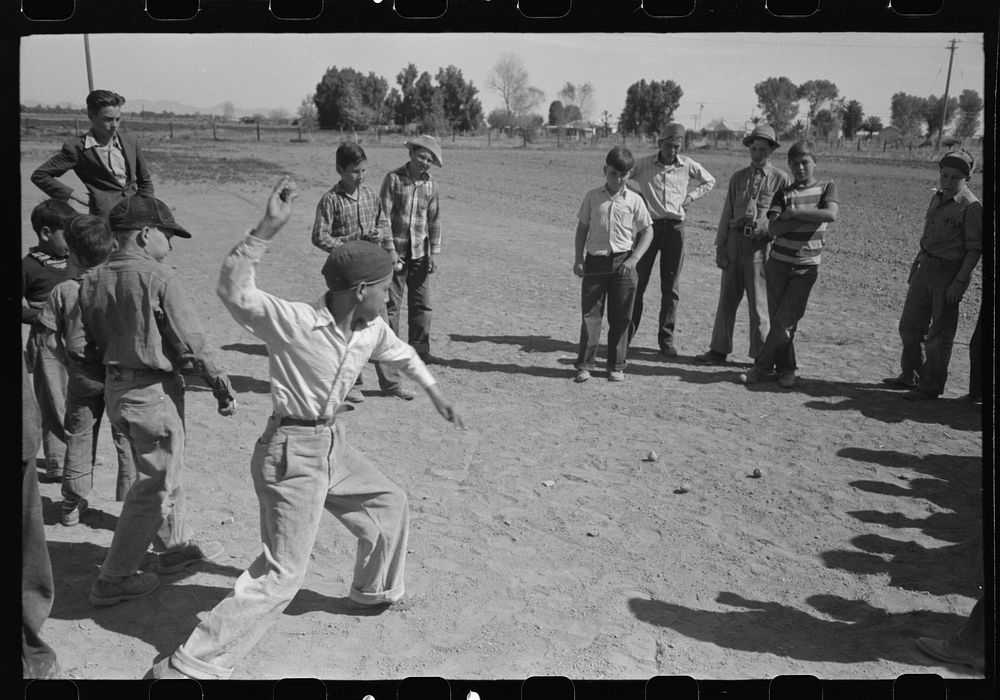 Top spinning contest at the annual field day of the FSA (Farm Security Administration) farmworkers community, Yuma, Arizona…