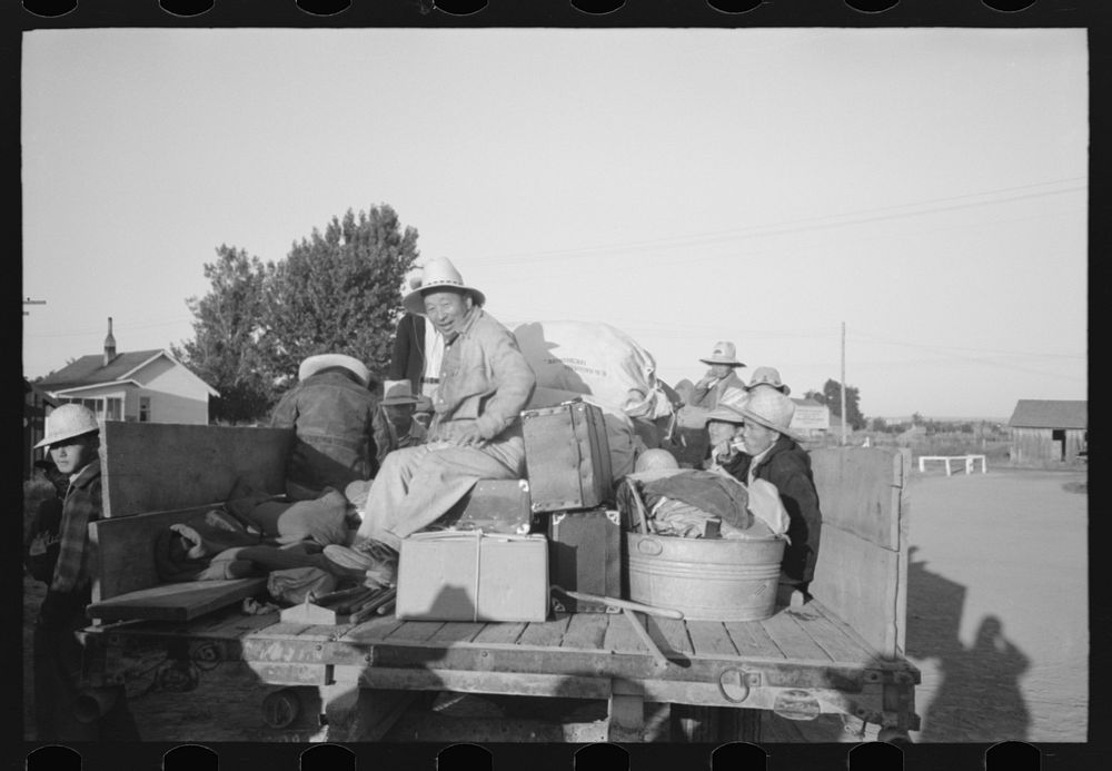 Nyssa, Oregon. FSA (Farm Security Administration) mobile camp. Japanese-American farm workers leaving the camp by Russell Lee