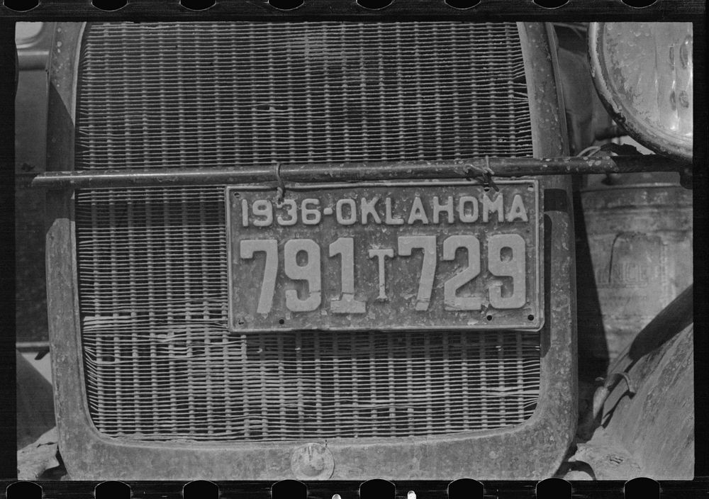 Radiator and license of Oklahoma cotton picker's car. San Joaquin Valley, near Fresno, California. Sourced from the Library…