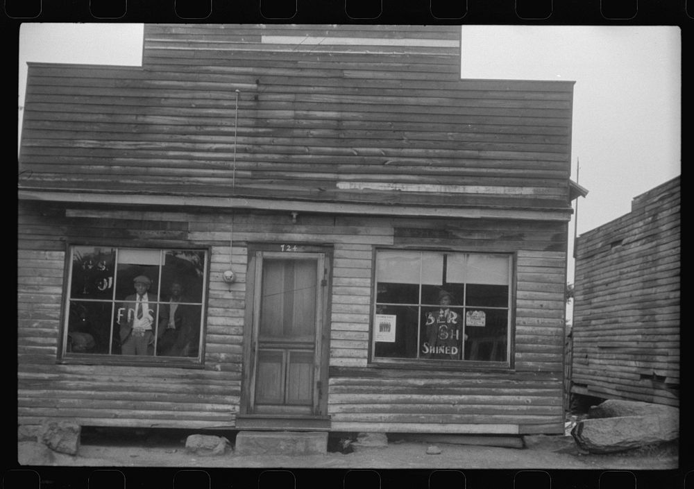 [Untitled photo, possibly related to: A combination pool room, barbershop, shoe shine parlor and general hangout for es in…