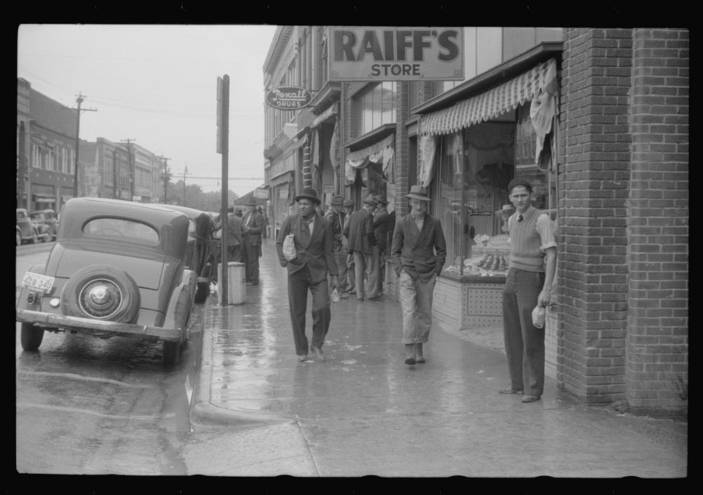 [Untitled photo, possibly related to: Rainy day on the main street of Roxboro, North Carolina]. Sourced from the Library of…
