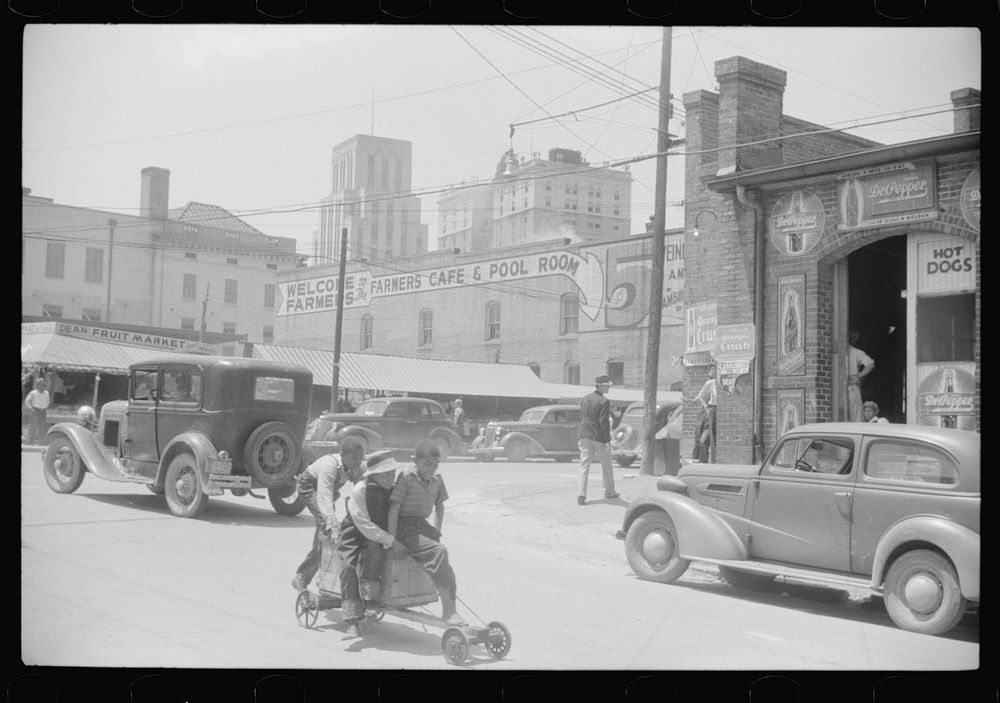[Outside of the tobacco warehouses in Durham, North Carolina]. Sourced from the Library of Congress.