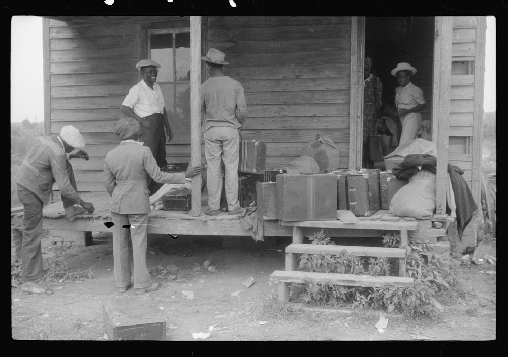Migratory crew of agricultural workers waiting to leave on their truck from Belcross, North Carolina to Onley, Virginia.…