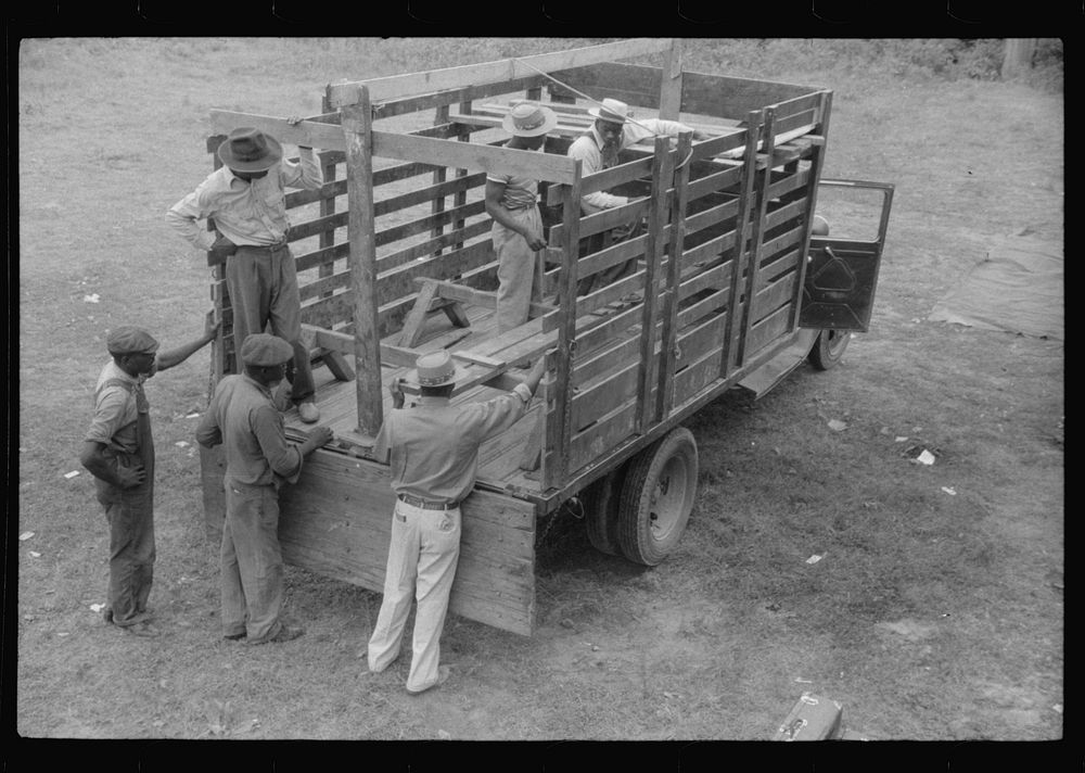 Florida migrants preparing their truck for a trip from Belcross, North Carolina to Onley, Virginia. Sourced from the Library…