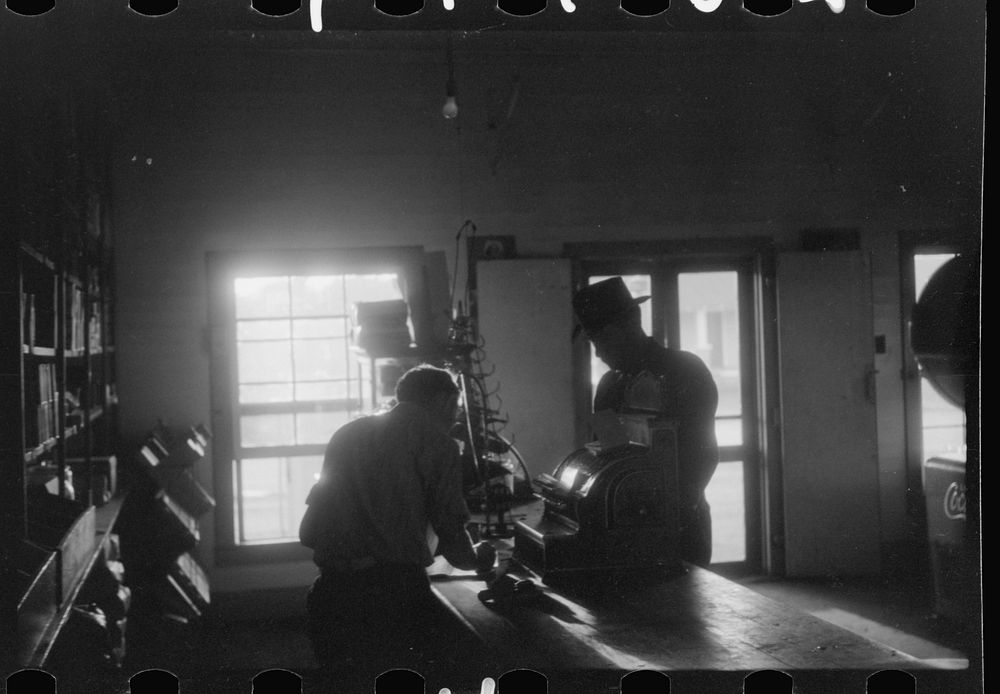 [Untitled photo, possibly related to: Migratory agricultural workers buying canned goods for supper at the company store.…