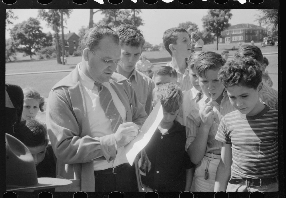One of the judges at soapbox auto race during July 4th celebration at Salisbury, Maryland. Sourced from the Library of…