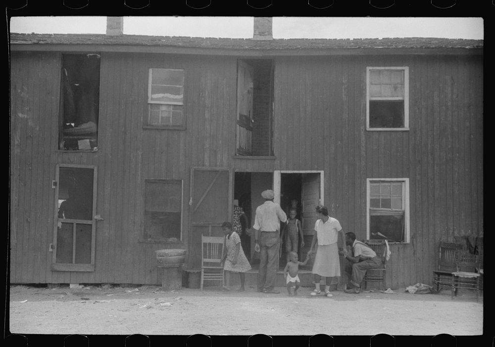 Permanent residents at the houses of W.T. Handy's packinghouse, Crisfield, Maryland. They work on canning vegetables for…