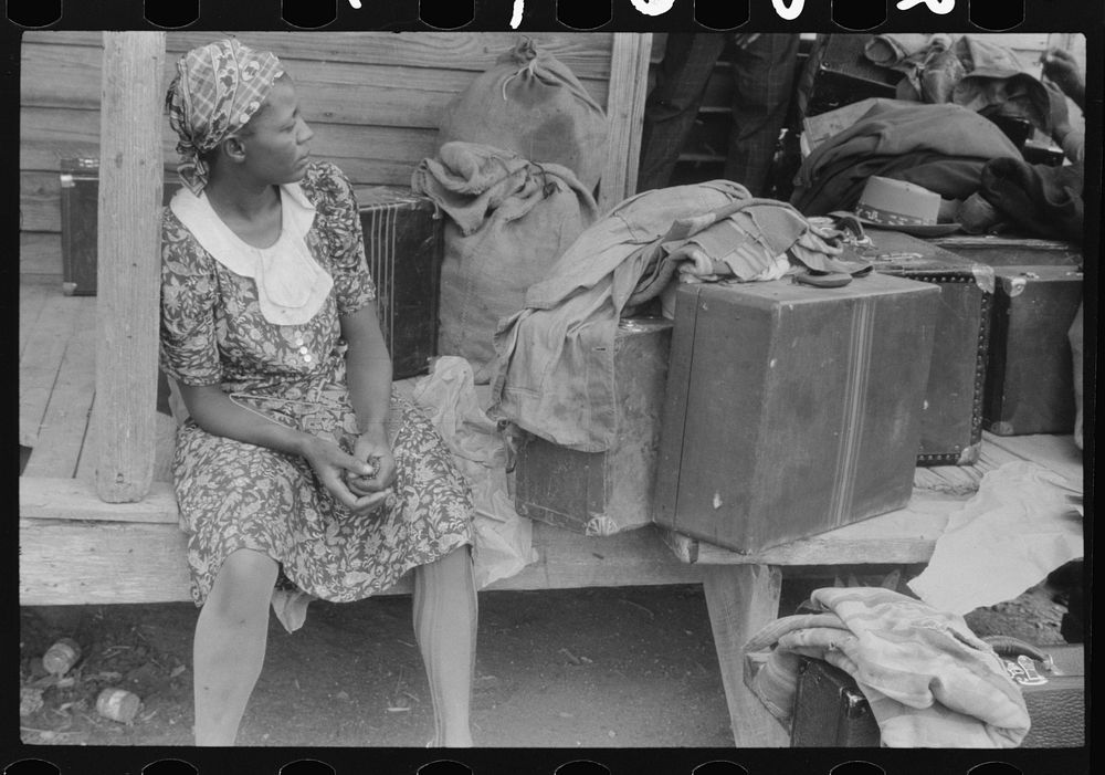 Georgia migratory agricultural worker waiting for the truck which will take her to another job at Onley, Virginia. Near…