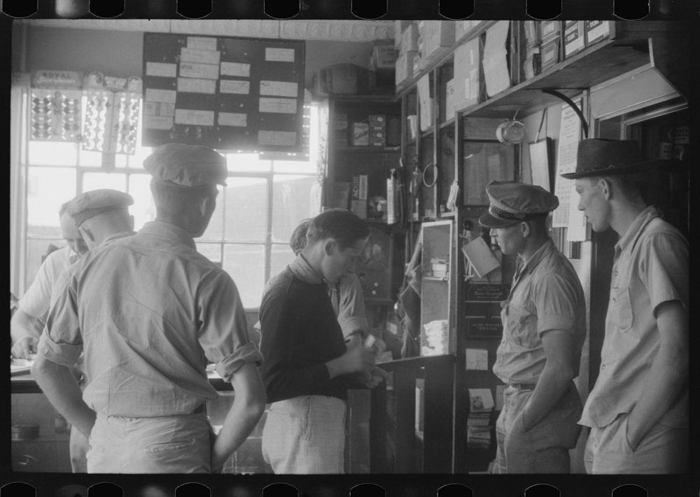[Untitled photo, possibly related to: Truck driver in front of bulletin board in a truck service station on U.S. 1 (New York…