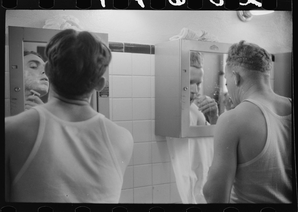 [Untitled photo, possibly related to: Truck drivers shaving at truck service station on U.S. 1 (New York Avenue)…