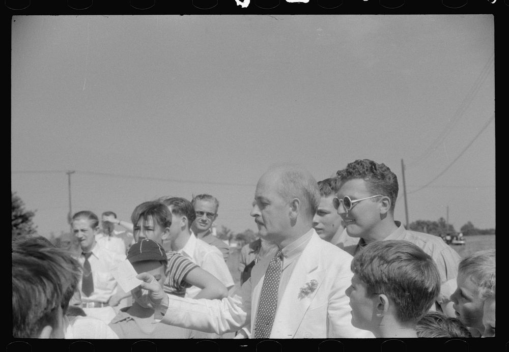 Checks being awarded winners of soapbox auto race during July 4th celebration, Salisbury, Maryland. Sourced from the Library…