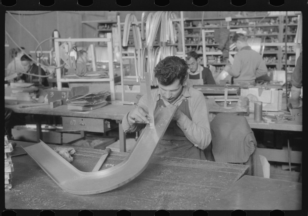 Checking dimensions on an airplane part at the Vought-Sikorsky Aircraft Corporation, Stratford, Connecticut. Sourced from…