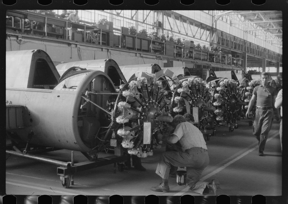 Mounting the engines in the Vought-Sikorsky Aircraft Corporation, Stratford, Connecticut. Sourced from the Library of…