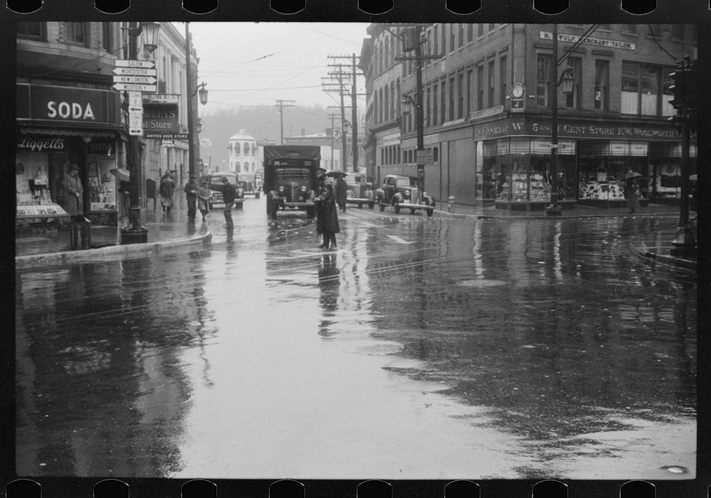 [Untitled photo, possibly related to: Main street intersection in Norwich, Connecticut on a rainy day]. Sourced from the…