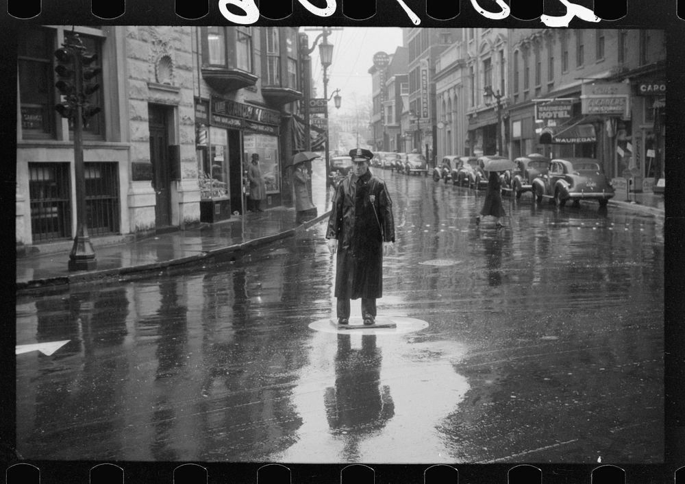 [Untitled photo, possibly related to: Street scene on a rainy day in Norwich, Connecticut]. Sourced from the Library of…