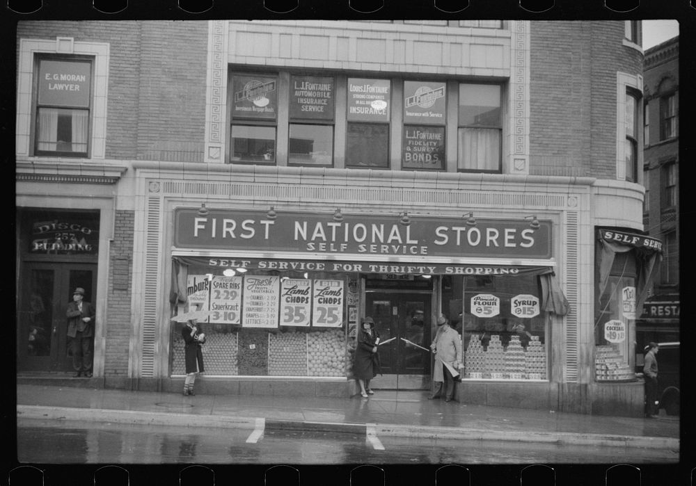 [Untitled photo, possibly related to: Street scene on rainy day in Norwich, Connecticut]. Sourced from the Library of…