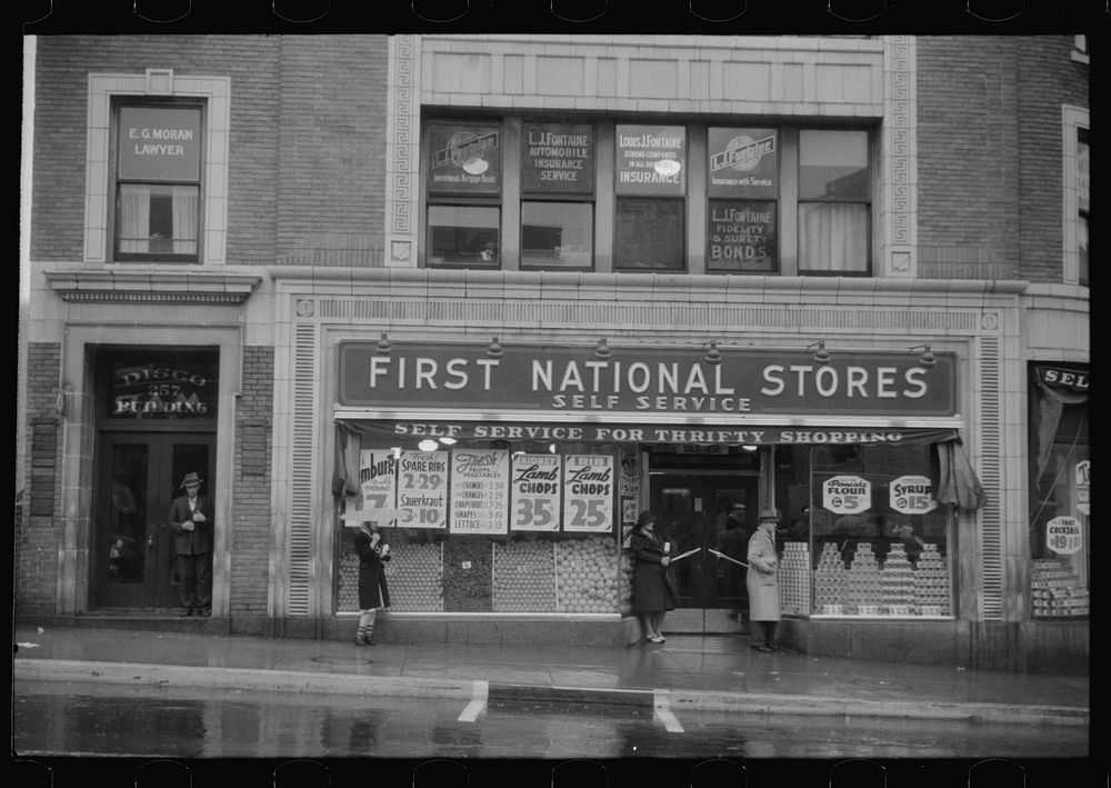Street scene on rainy day in Norwich, Connecticut. Sourced from the Library of Congress.