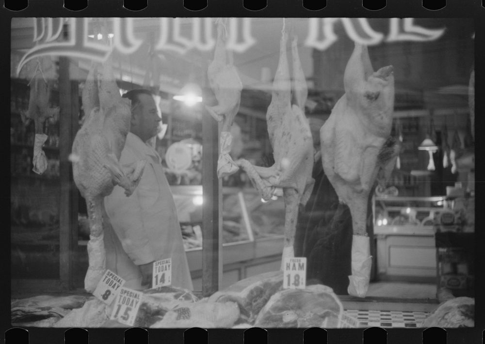 A butcher shop window at Thanksgiving time. Norwich, Connecticut. Sourced from the Library of Congress.