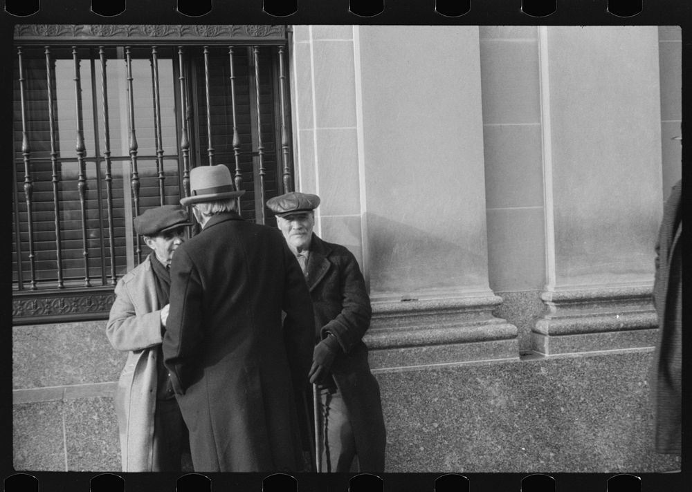 [Untitled photo, possibly related to: Men outside of a bank in Woonsocket, Rhode Island]. Sourced from the Library of…