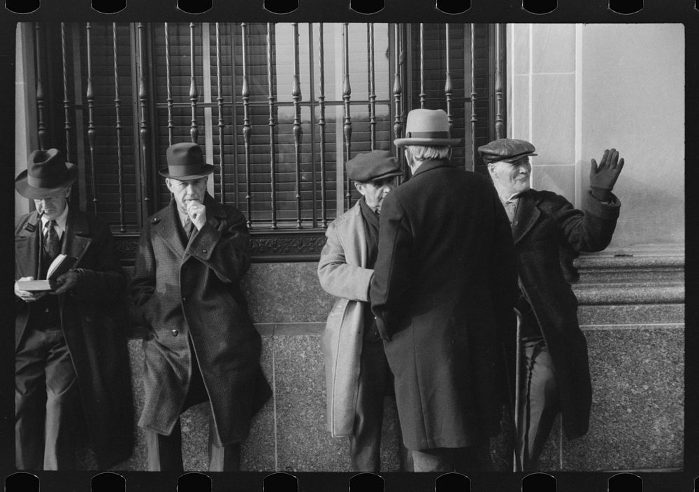 Men outside of a bank in Woonsocket, Rhode Island. Sourced from the Library of Congress.