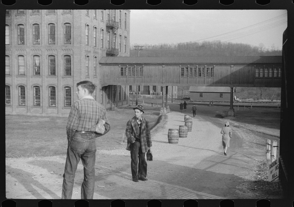 At the change of the shift at the Penomah Mills Inc., Taftville, Connecticut. Sourced from the Library of Congress.