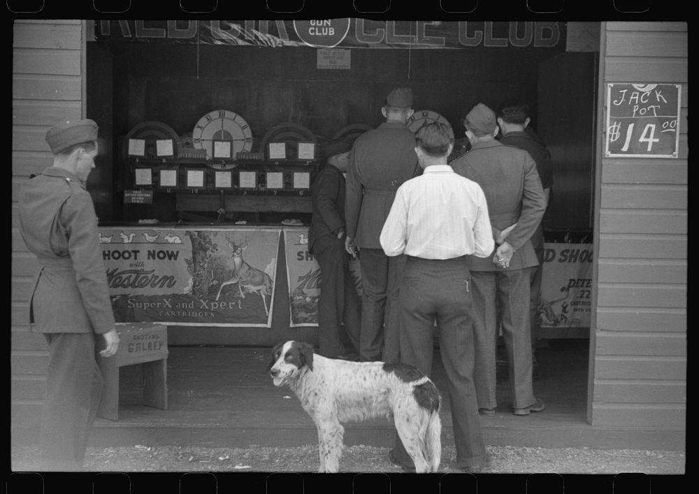 [Untitled photo, possibly related to: A variety of entertainment booths have sprung up just outside the camp grounds, near…