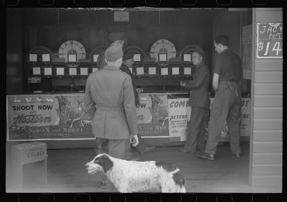 [Untitled photo, possibly related to: A variety of entertainment booths have sprung up just outside the camp grounds, near…