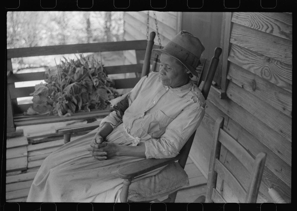 Mrs. L.A. Anderson, living in the Camp Croft area, who has come to help a neighbor move. Near Spartanburg, South Carolina.…