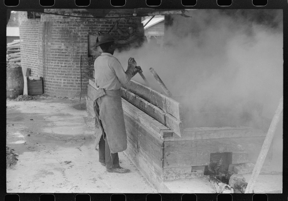 [Untitled photo, possibly related to: Filtering hot rosin through sieves at a turpentine works in Statesboro, Georgia].…