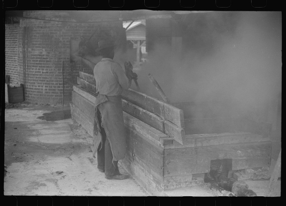 [Untitled photo, possibly related to: Filtering hot rosin through sieves at a turpentine works in Statesboro, Georgia].…