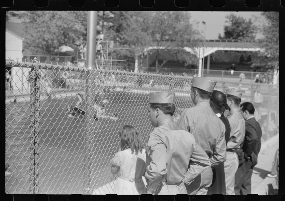 Soldiers from Fort Benning watching bathers in pool at Idle Hour park near Phenix City, Alabama. Sourced from the Library of…