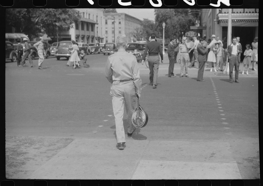 Soldier from Fort Benning on a street in Columbus, Georgia. Sourced from the Library of Congress.