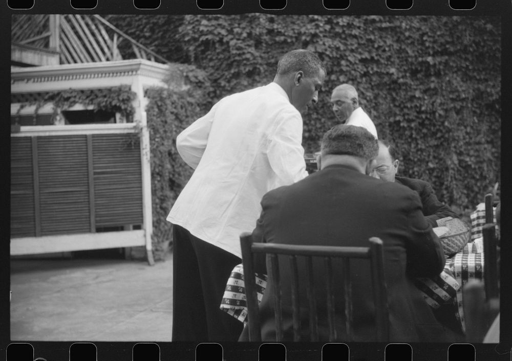 Waiter in a restaurant in Washington, D.C.. Sourced from the Library of Congress.