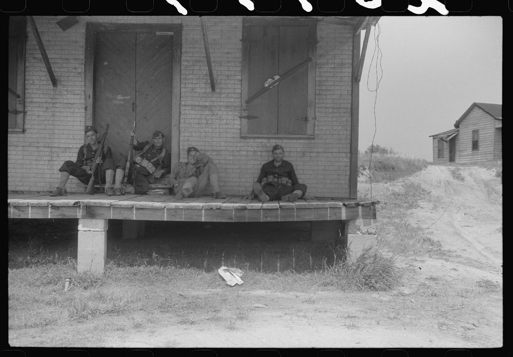 [Untitled photo, possibly related to: Soldiers resting at an abandoned store during maneuvers in Caroline County, Virginia].…