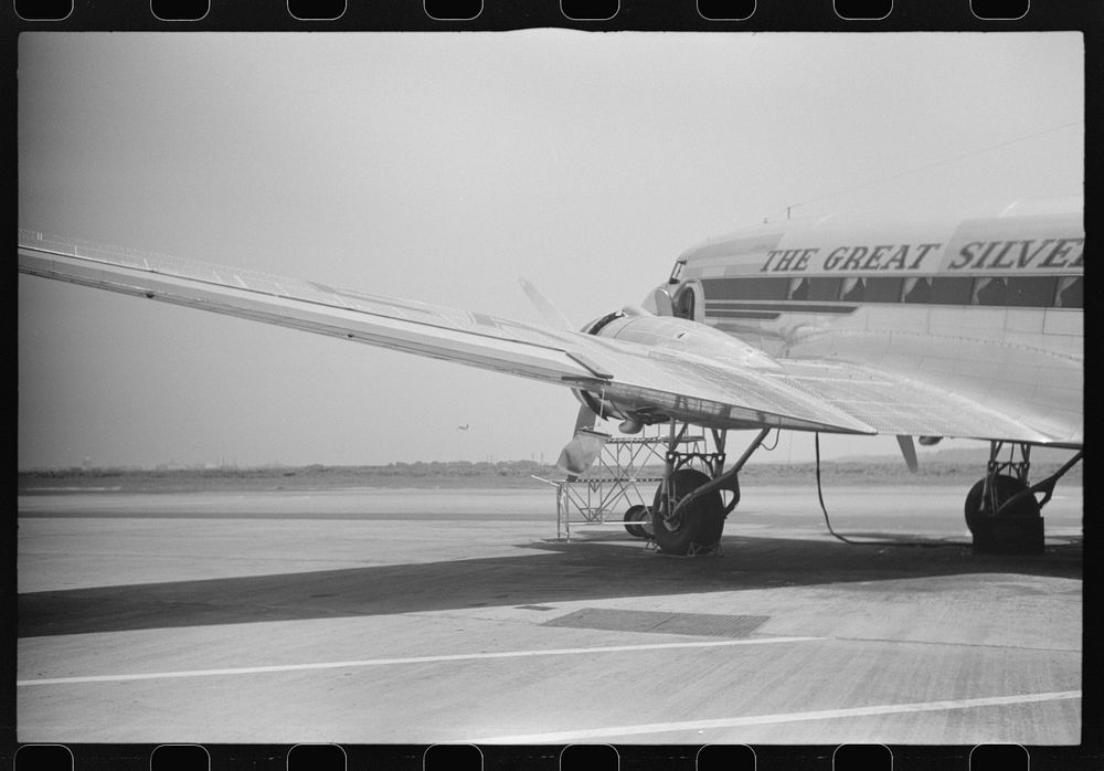 A plane on the field at the municipal airport in Washington, D.C.. Sourced from the Library of Congress.