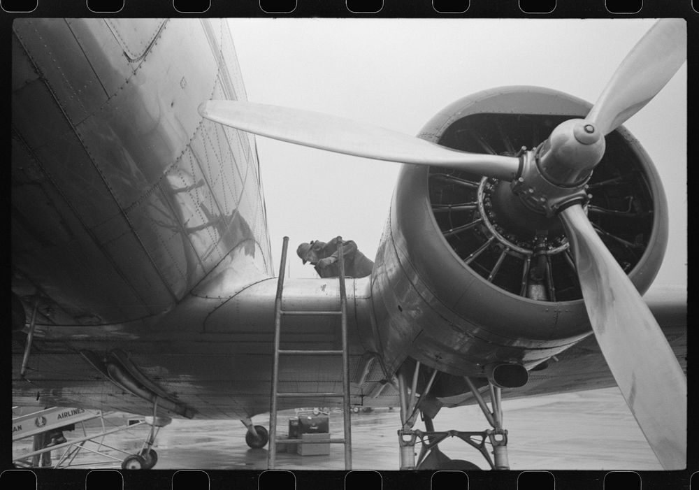 Checking the fuel on a plane at the municipal airport on a rainy day, Washington, D.C.. Sourced from the Library of Congress.