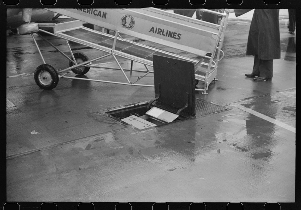 [Untitled photo, possibly related to: Passengers boarding a plane on a rainy day at the municipal airport in Washington…