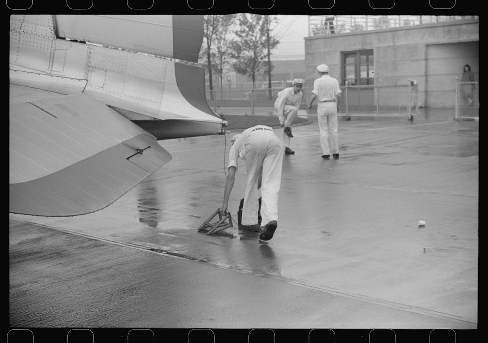 Ground crew assistants leaving a plane to take off, Washington, D.C.. Sourced from the Library of Congress.