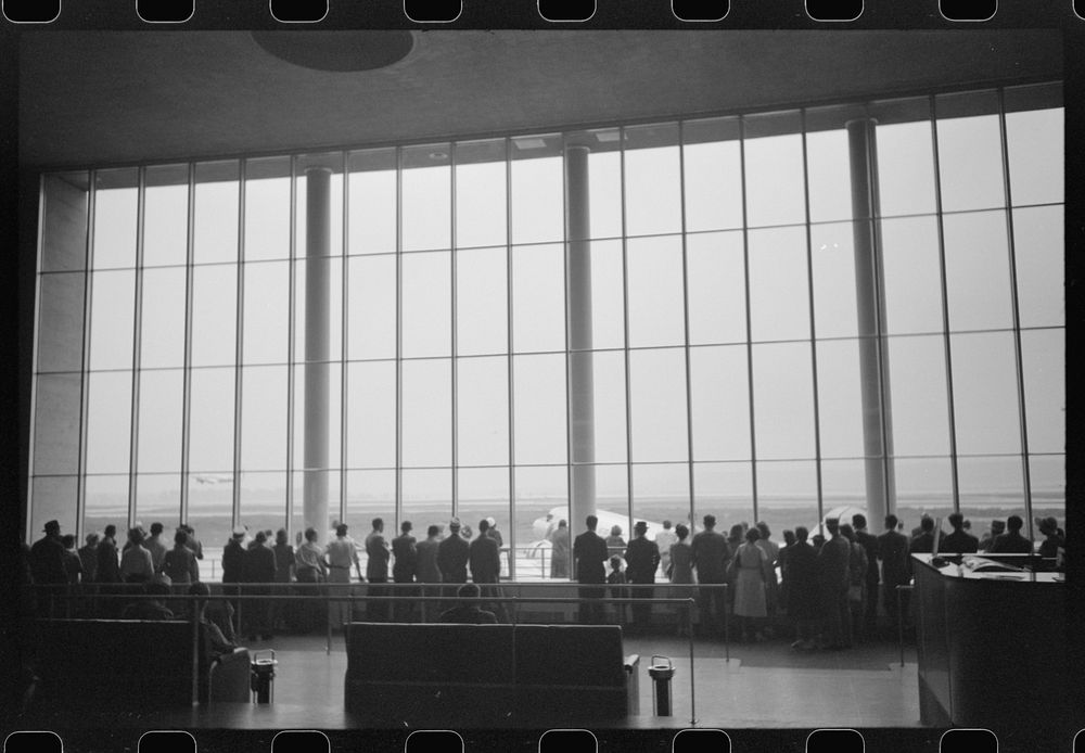 [Untitled photo, possibly related to: Visitors watching planes. Seen from waiting platform at the municipal airport in…