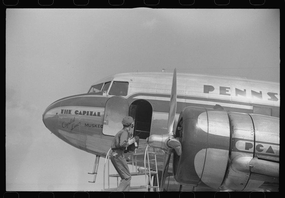 Loading baggage on a plane at the municipal airport in Washington, D.C.. Sourced from the Library of Congress.