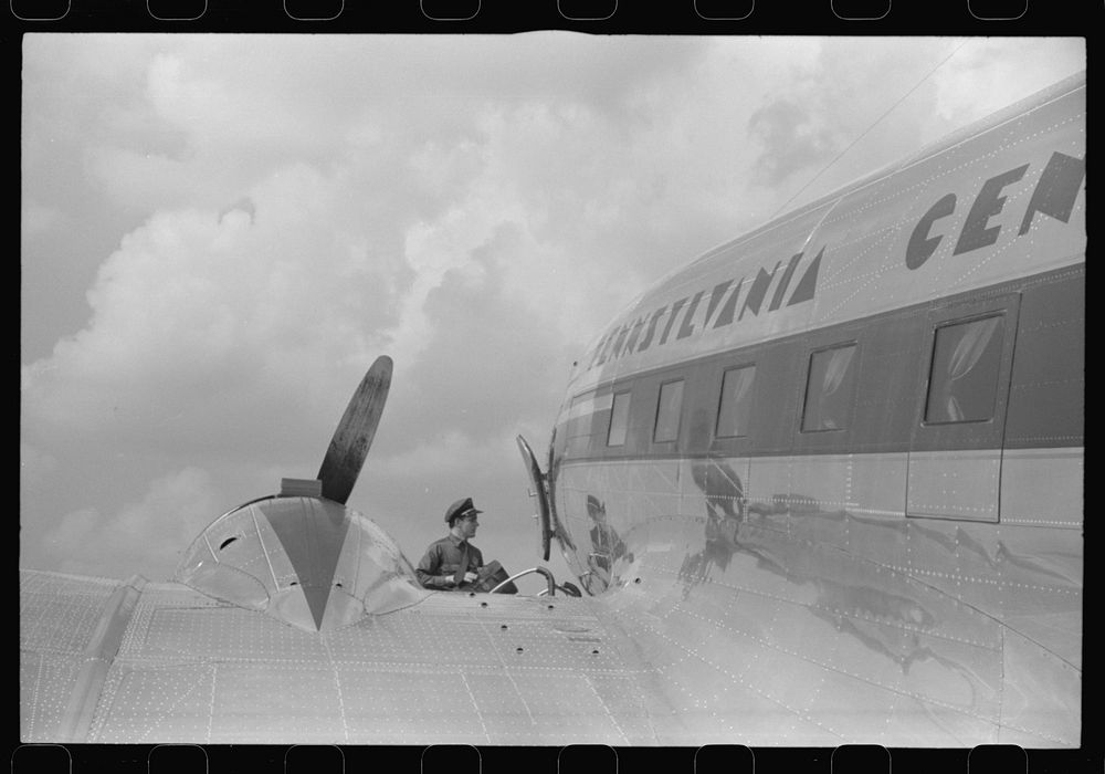 [Untitled photo, possibly related to: Loading baggage on a plane at the municipal airport in Washington, D.C.]. Sourced from…