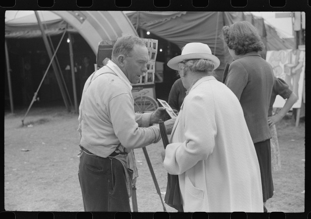 [Untitled photo, possibly related to: Tintype photographer trying to make a sale at the Champlain Valley Exposition, Essex…