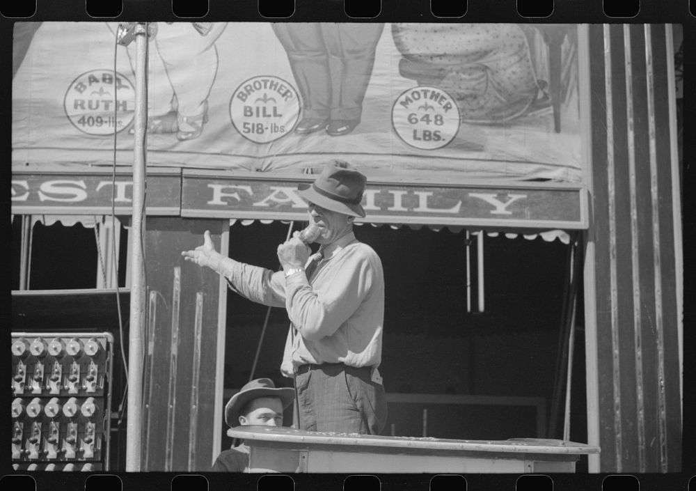 Barker at a sideshow at the Rutland Fair, Rutland, Vermont. Sourced from the Library of Congress.