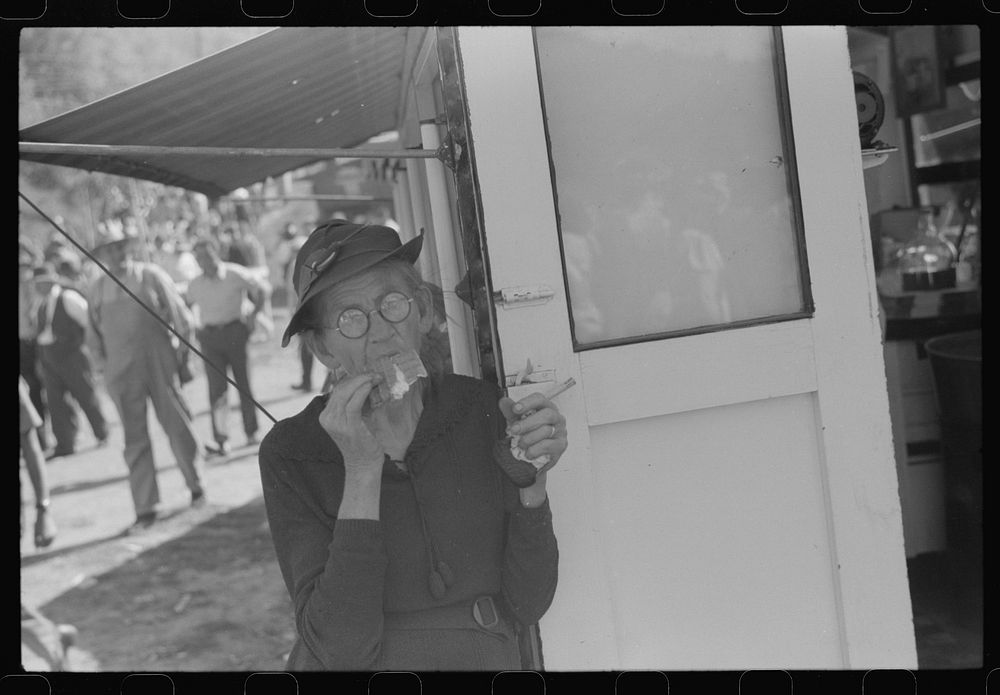 [Untitled photo, possibly related to: Eating ice cream at the "World's Fair" in Tunbridge, Vermont]. Sourced from the…
