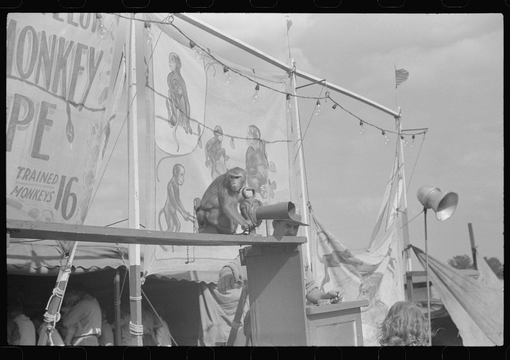 [Untitled photo, possibly related to: Barker at the Greene County fair in Greensboro, Georgia]. Sourced from the Library of…