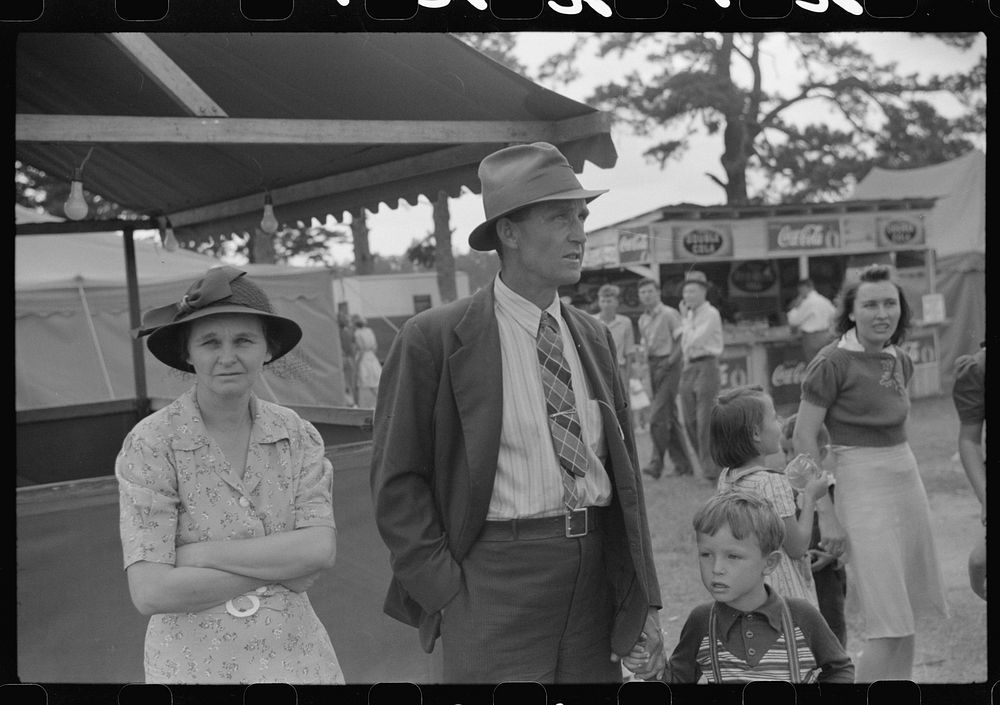 [Untitled photo, possibly related to: Family at the Greene County fair in Greensboro, Georgia]. Sourced from the Library of…