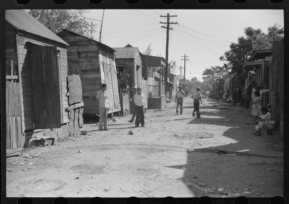 Street in the slum area known as "El Machuelitto" in Ponce, Puerto Rico. Sourced from the Library of Congress.